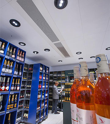 Exceptional contrast and sparkle in the wine section at Irma supermarket by Philips lighting products 